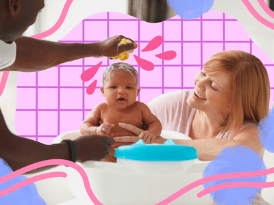 Parents giving baby a bath