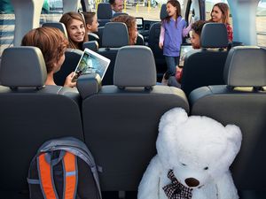 Ford Transit Interior with large family on smart devices