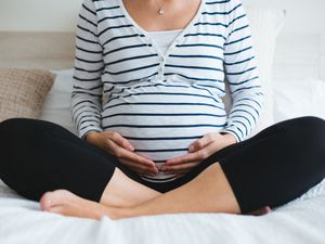 pregnant woman meditating