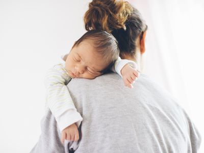 New mom holding sleeping newborn