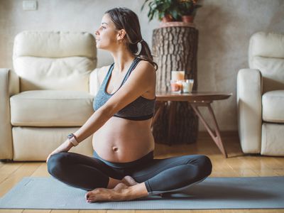 pregnant woman exercising at home