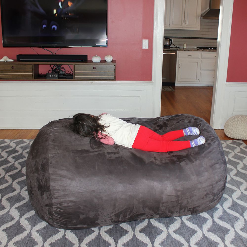 three post bean bag chair with child laying down