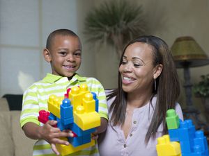 little boy and his mom playing with legos