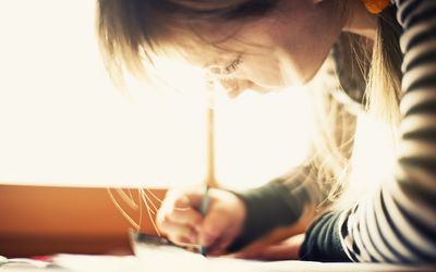 A picture of a child writing her name