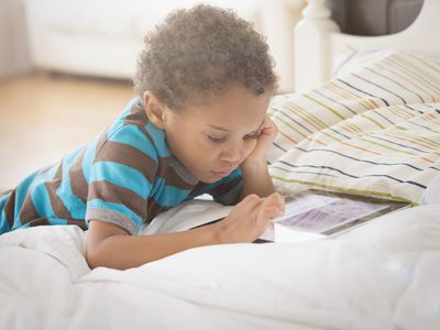 Young boy looking at digital tablet