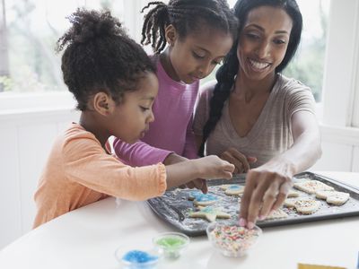 Mom baking with her kids.