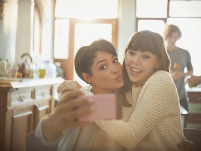 Teen girls taking selfie