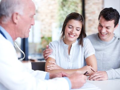 Couple interview fertility doctor at fertility clinic