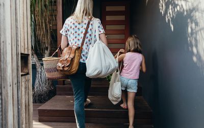 step mom and daughter walking up some stairs