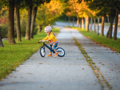 young child on a balance bike