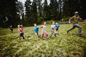 Kids and counselor play at camp