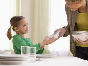 girl setting the table