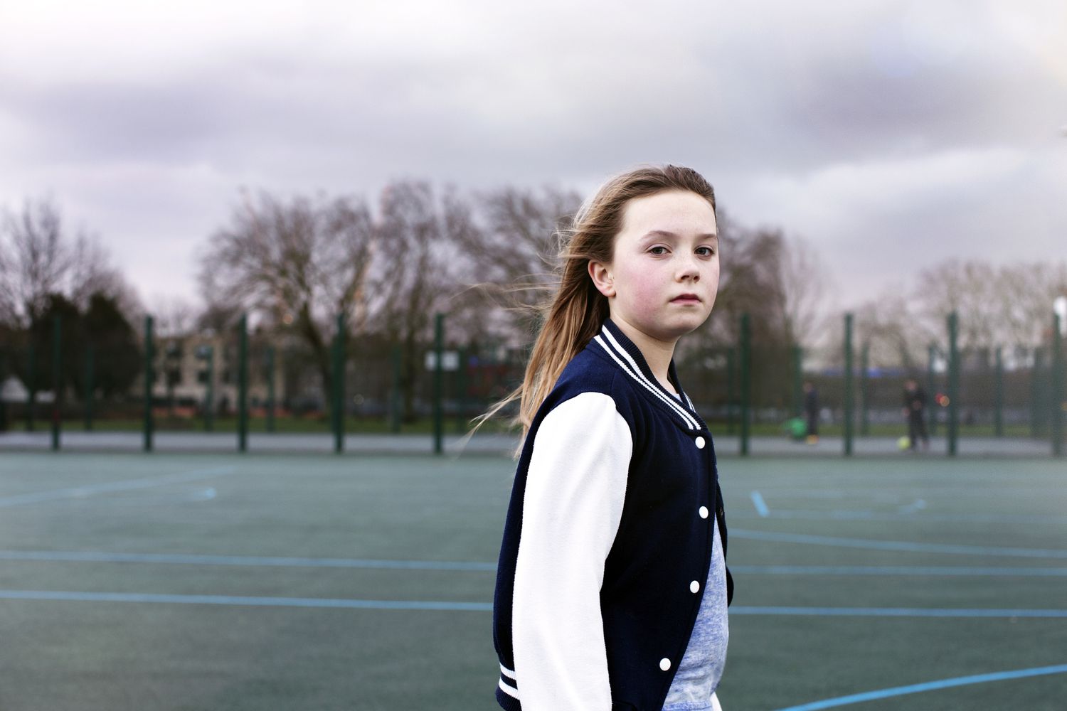 Young girl in the park looking serious