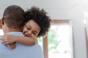 father hugging child