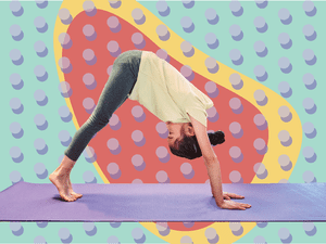 Child doing downward dog on yoga mat