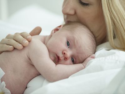 Woman holding newborn baby