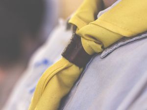 Midsection Of Boy Wearing Scout Scarf