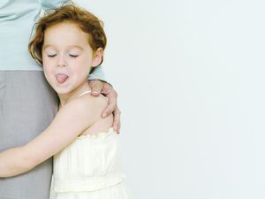 rude behavior in kids - girl sticking out her tongue