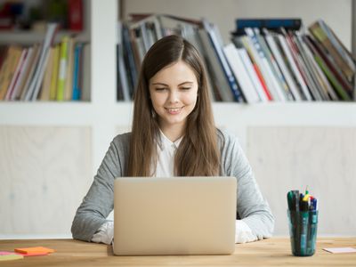 Young high school girl on laptop