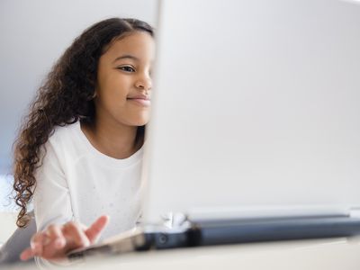 close up of a girl using laptop