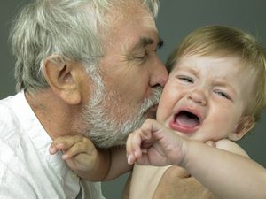 Stranger anxiety may be to blame when a grandbaby rejects a grandparent and cries.