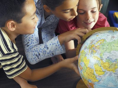 Children Looking at Globe