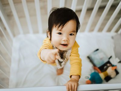 Baby standing in crib