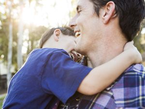 a father and son laughing