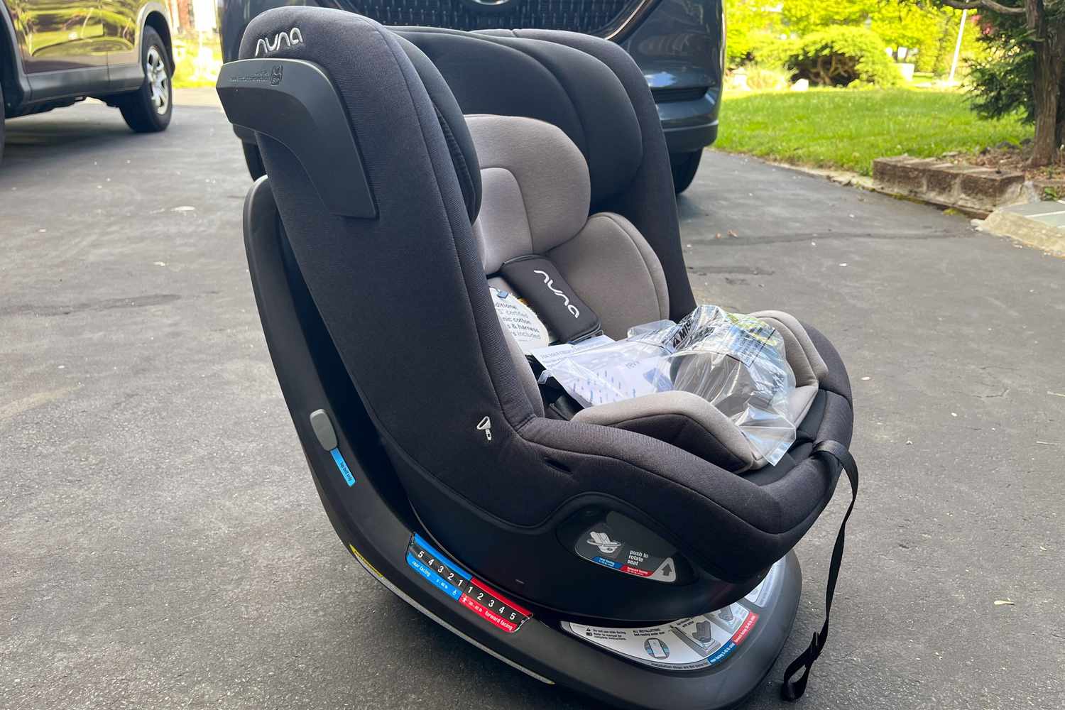 Nuna REVV Rotating Convertible Car Seat placed on cement floor