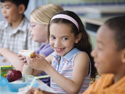 A picture of kids eating lunch at school