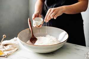 Sprinkling salt in a bowl