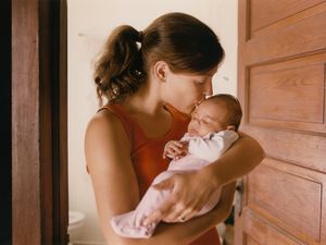 New mom holding newborn baby