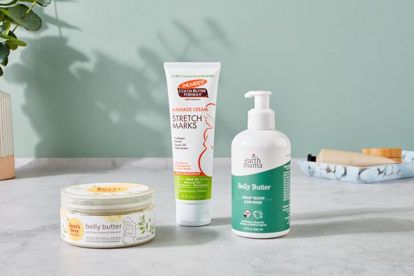 Several stretch mark creams we recommend displayed on a gray counter