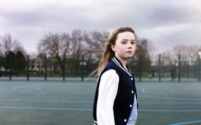 Young girl in the park looking serious