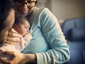 mother holding newborn baby