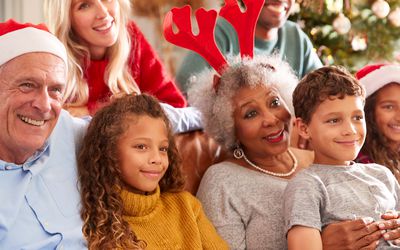 multi-generation family watching Christmas movie