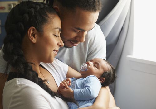 Mom and dad with newborn baby