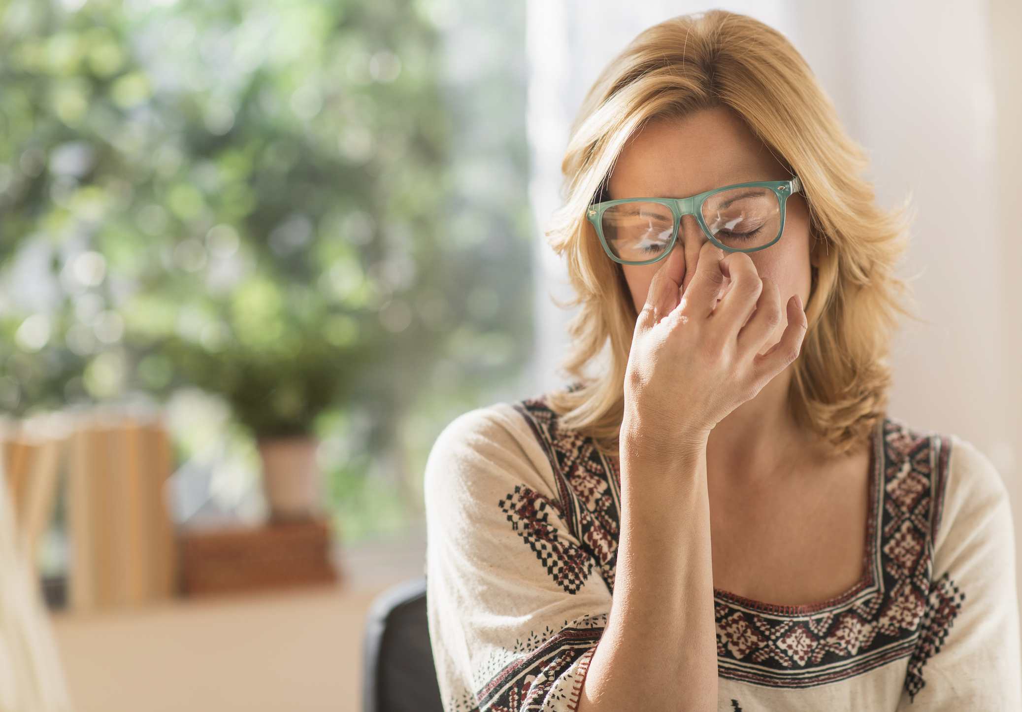 stressed adult woman with headache