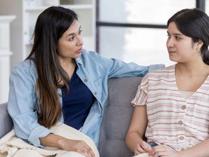 Mom having an important conversation with daughter about sneaking out