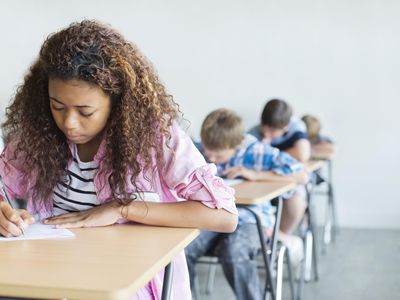 Students taking a test in classroom.