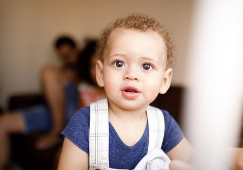 portrait of a baby by the window