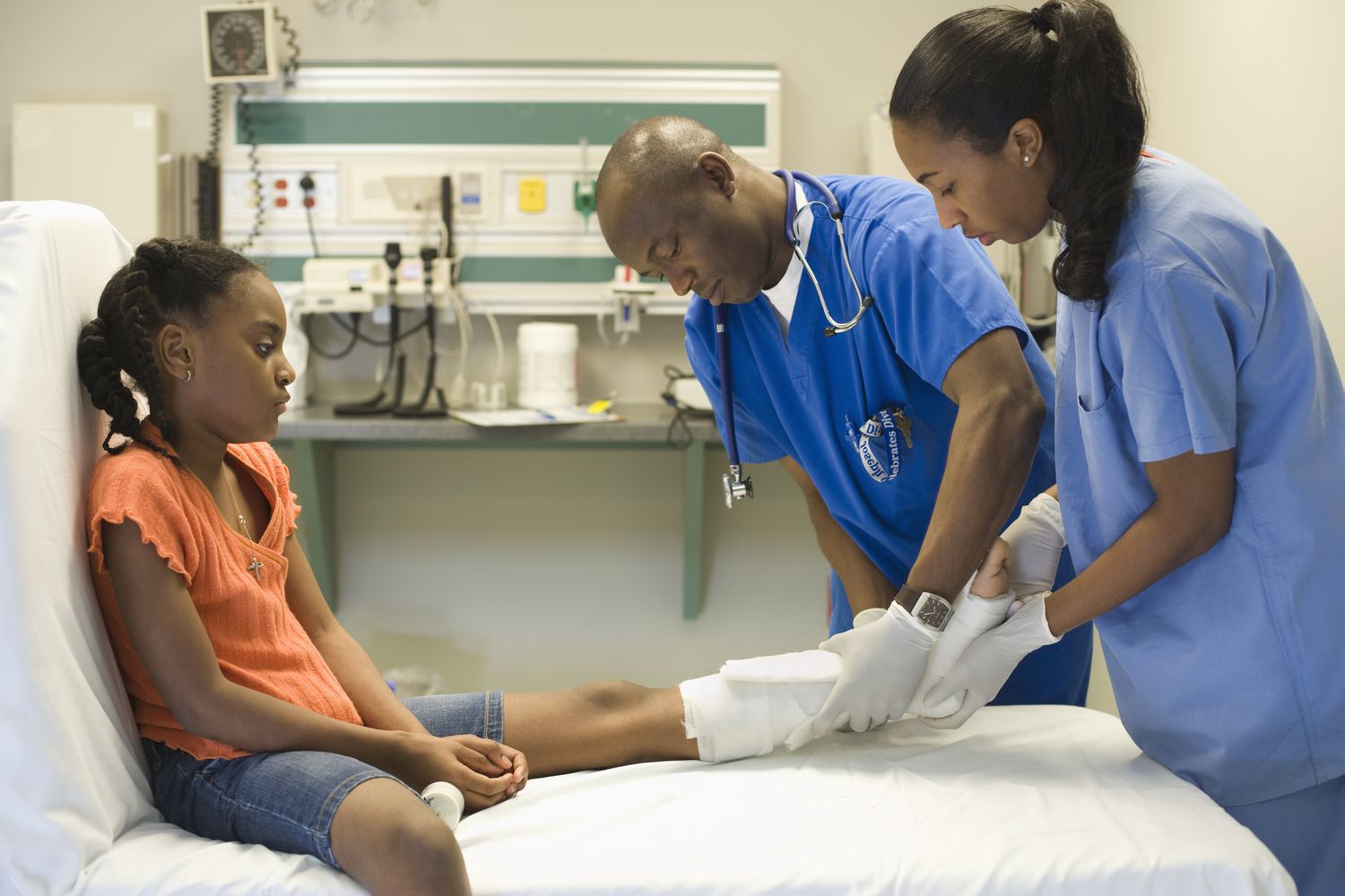 child being examined in an emergency room