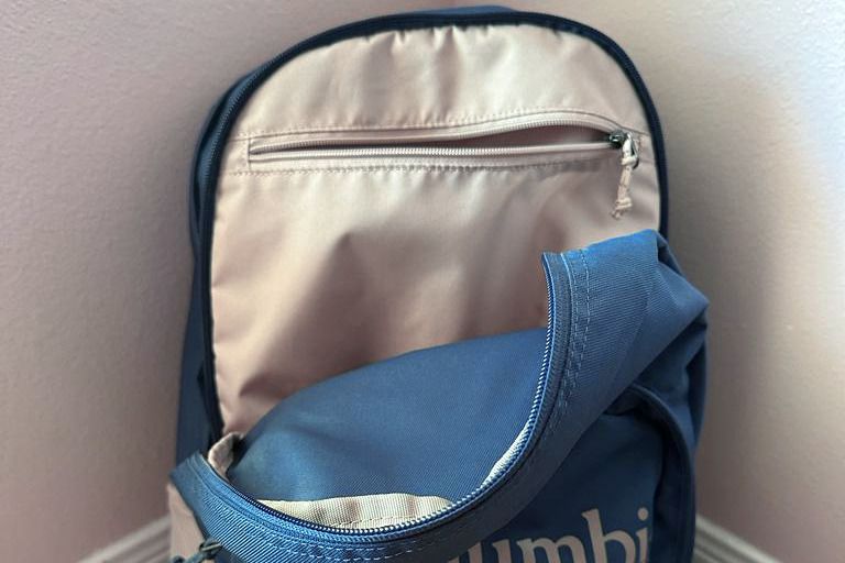 Columbia Zigzag 30L Backpack opened and leaned against a wall