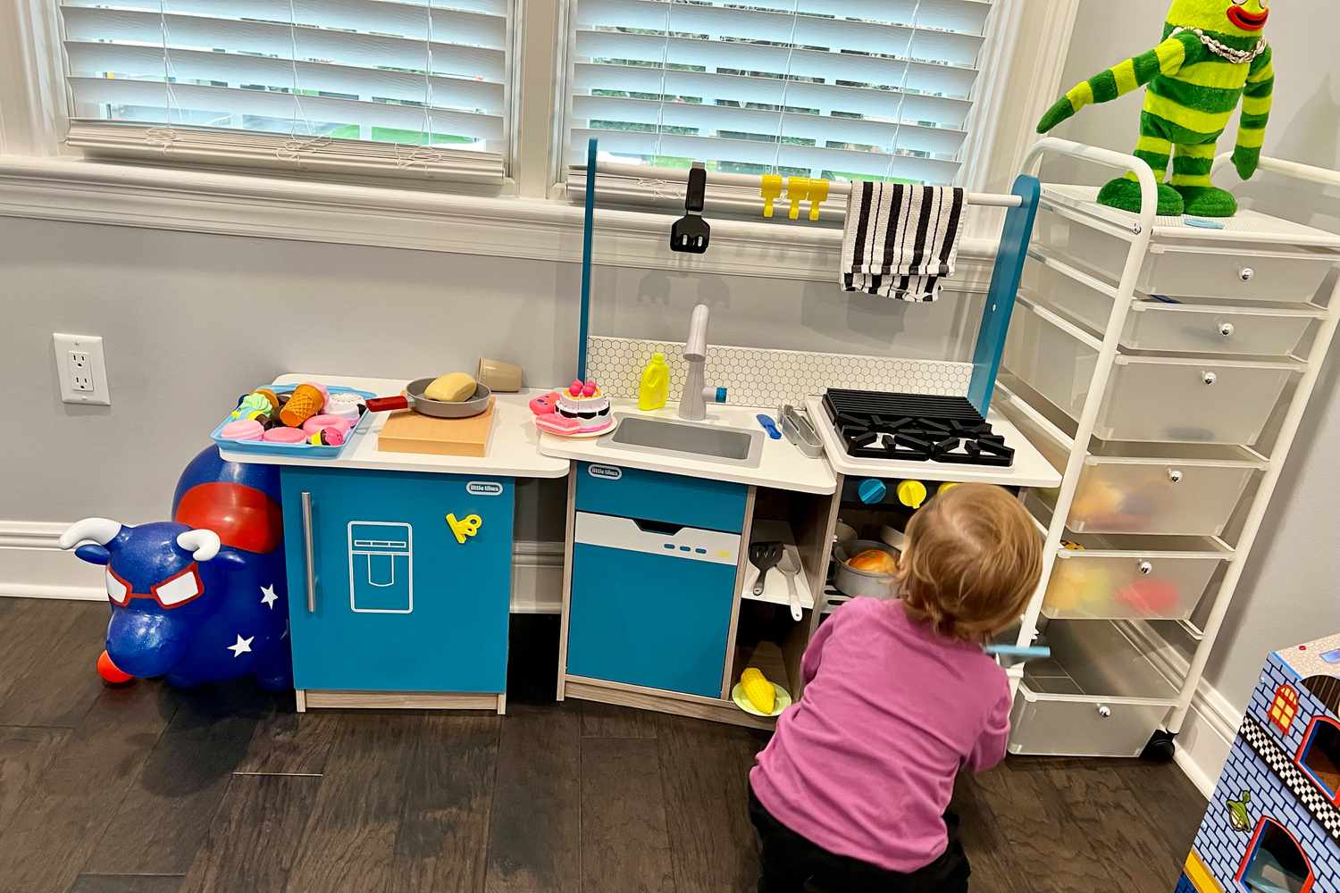 Little Tikes Real Wood Kitchen with Island being tested by child