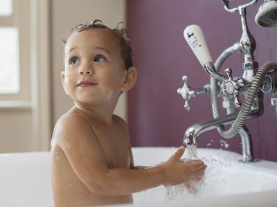 Young boy having a bath