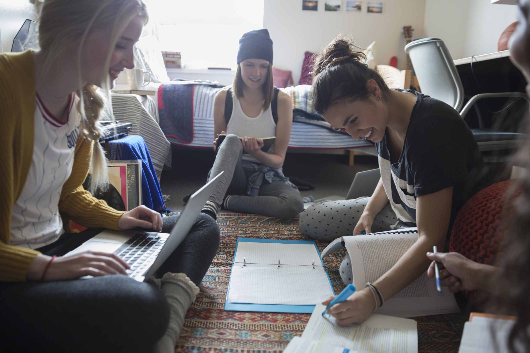 Group of women studying in a dorm room