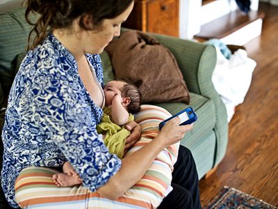 Woman using breastfeeding tracker