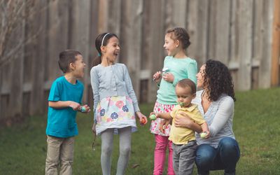 mother with 4 kids preparing for Easter egg hunt