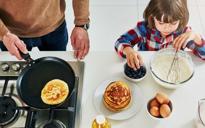 kid making pancakes