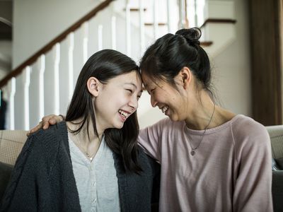 mom and daughter laughing